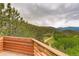 Beautiful views of the wooded hills surrounding this property, seen from the deck at 1575 York Gulch Rd, Idaho Springs, CO 80452