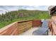 Enjoy the lush green forest and mountain views from this relaxing, secluded deck at 1575 York Gulch Rd, Idaho Springs, CO 80452