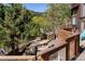 Exterior view of a wooden home showing a shed and wooded landscape at 1575 York Gulch Rd, Idaho Springs, CO 80452