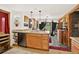 Open-concept kitchen with stainless steel appliances, a breakfast bar, and views into the dining area at 1575 York Gulch Rd, Idaho Springs, CO 80452