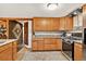 Well-equipped kitchen featuring wooden cabinetry and granite countertops with easy access to other rooms at 1575 York Gulch Rd, Idaho Springs, CO 80452