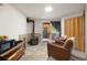 Cozy living room featuring a wood stove, seating, and access to the outdoors at 1575 York Gulch Rd, Idaho Springs, CO 80452