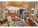 Cozy living room with stone accents, wood beams, and a charming wood-burning stove at 1575 York Gulch Rd, Idaho Springs, CO 80452