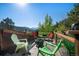Relaxing outdoor deck area with comfortable seating, a fire pit, and scenic mountain views at 1575 York Gulch Rd, Idaho Springs, CO 80452