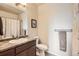 Clean bathroom featuring a vanity with a countertop, a mirror, and a towel rack at 7292 S Blackhawk St # 2-204, Englewood, CO 80112