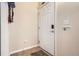 Clean entryway featuring a white door, ceramic tile floor, and coat rack at 7292 S Blackhawk St # 2-204, Englewood, CO 80112
