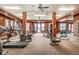 Well-equipped fitness center with various cardio machines, weights, and a mirrored wall, perfect for workouts at 7292 S Blackhawk St # 2-204, Englewood, CO 80112