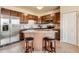 Charming kitchen with stainless appliances, an island with barstool seating, and abundant cabinet space at 7292 S Blackhawk St # 2-204, Englewood, CO 80112