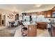 Open kitchen boasts stainless steel appliances, a breakfast bar, and ample cabinet space at 7292 S Blackhawk St # 2-204, Englewood, CO 80112