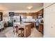 Well-lit kitchen featuring stainless steel appliances, granite countertops, and a stylish kitchen island with seating at 7292 S Blackhawk St # 2-204, Englewood, CO 80112