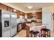 Modern kitchen featuring stainless steel appliances, and a breakfast bar with seating at 7292 S Blackhawk St # 2-204, Englewood, CO 80112