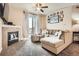 Comfortable living room with a fireplace, large sofa, and balcony access at 7292 S Blackhawk St # 2-204, Englewood, CO 80112