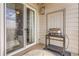 Cozy patio with a grill, sliding glass door, and a small table for outdoor dining and relaxation at 7292 S Blackhawk St # 2-204, Englewood, CO 80112