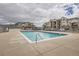Inviting community pool area with lounge seating and well-maintained landscaping near apartment buildings at 7292 S Blackhawk St # 2-204, Englewood, CO 80112