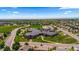 Wide aerial shot of a community, featuring a school, green spaces, and residential areas at 265 Calhoun Cir, Castle Rock, CO 80104