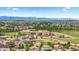 Scenic aerial view showcasing community with mountain backdrop, surrounded by lush greenery at 265 Calhoun Cir, Castle Rock, CO 80104