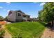 Expansive, lush backyard with well-maintained lawn and charming patio area, perfect for outdoor enjoyment at 265 Calhoun Cir, Castle Rock, CO 80104
