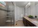 Bathroom featuring a glass shower with a seat and a granite countertop with a double sink at 265 Calhoun Cir, Castle Rock, CO 80104