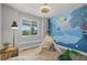Bright bedroom with a playful mural wall, tent, and ample natural light at 265 Calhoun Cir, Castle Rock, CO 80104