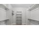 Walk-in closet with built-in shelving and ample storage space at 265 Calhoun Cir, Castle Rock, CO 80104