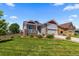 Attractive home featuring neutral siding, stone accents, and a well-maintained front yard at 265 Calhoun Cir, Castle Rock, CO 80104