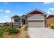 Charming home featuring stone accents, neutral siding, and a well-manicured front yard at 265 Calhoun Cir, Castle Rock, CO 80104