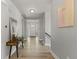 Bright foyer with wood flooring, white door with windows, and decorative accents at 265 Calhoun Cir, Castle Rock, CO 80104