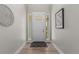 Bright foyer with wood flooring, white door with windows, and modern decorative accents at 265 Calhoun Cir, Castle Rock, CO 80104