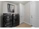 Laundry room with modern, stainless steel appliances and easy access to other rooms at 265 Calhoun Cir, Castle Rock, CO 80104