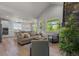 Open floor plan showing living room and kitchen with modern finishes, natural light, and wood flooring at 265 Calhoun Cir, Castle Rock, CO 80104