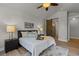 Bright main bedroom with vaulted ceiling, ceiling fan, and barn door to ensuite bathroom at 265 Calhoun Cir, Castle Rock, CO 80104