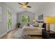 Main bedroom features a ceiling fan, large windows, and stylish decor for a restful retreat at 265 Calhoun Cir, Castle Rock, CO 80104