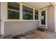 Covered patio with neutral siding and a 'HOME' doormat at 265 Calhoun Cir, Castle Rock, CO 80104