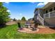 Outdoor patio featuring seating area, ideal for entertaining, adjacent to the home's yard and entrance at 265 Calhoun Cir, Castle Rock, CO 80104