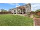 Backyard with a pergola covered patio, dining area, and grassy lawn, great for outdoor living at 484 N Jamestown Way, Aurora, CO 80018