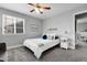 Bedroom featuring neutral tones, ceiling fan, and a large window at 484 N Jamestown Way, Aurora, CO 80018