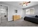 Bedroom featuring a bed, dresser, natural light, and access to hallway with a mirror at 484 N Jamestown Way, Aurora, CO 80018