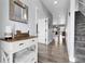 Bright entryway featuring hardwood floors, staircase, and tasteful decor, creating a welcoming atmosphere at 484 N Jamestown Way, Aurora, CO 80018