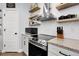 Close up kitchen shot featuring stainless steel appliances and modern countertops and backsplash at 484 N Jamestown Way, Aurora, CO 80018