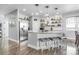 Modern kitchen featuring a center island, stainless steel appliances, stylish pendant lighting, and ample counter space at 484 N Jamestown Way, Aurora, CO 80018