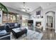 Inviting living room featuring a cozy fireplace, vaulted ceilings, and abundant natural light at 484 N Jamestown Way, Aurora, CO 80018