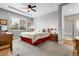 Spacious main bedroom features tray ceiling, ceiling fan, and ensuite bathroom at 484 N Jamestown Way, Aurora, CO 80018