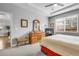 Another view of a main bedroom with a sitting area, good natural light, and ensuite at 484 N Jamestown Way, Aurora, CO 80018
