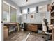 Home office featuring hardwood floors, ample desk space, and bright natural light at 484 N Jamestown Way, Aurora, CO 80018