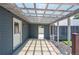 Covered back porch with see-through roof panels allowing natural light to illuminate the area at 995 Chase St, Lakewood, CO 80214