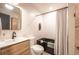 Modern bathroom with sleek fixtures, black soaking tub, and elegant tile work at 995 Chase St, Lakewood, CO 80214