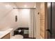 Well-lit bathroom featuring a modern black soaking tub and shower with a convenient built-in niche at 995 Chase St, Lakewood, CO 80214