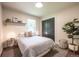 Cozy bedroom with a neutral color palette, closet, and a window for natural light at 995 Chase St, Lakewood, CO 80214