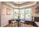 Cozy dining nook with a round table, seating, and views from the window at 995 Chase St, Lakewood, CO 80214