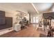 Versatile workout room with fitness equipment, hardwood floors, and natural light from French doors at 995 Chase St, Lakewood, CO 80214